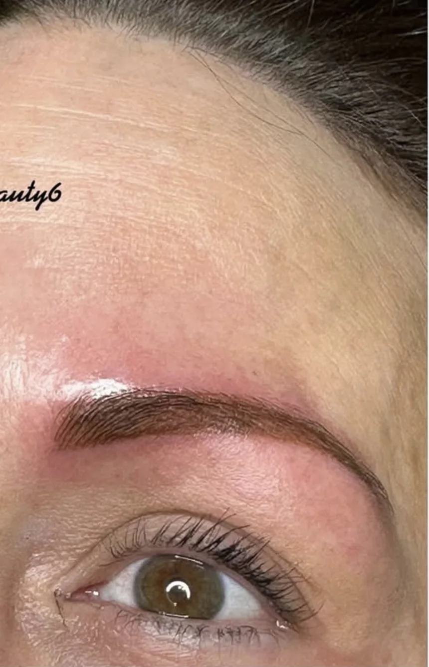 A close-up of a healed, natural-looking brow tattoo by Kreative Beauty
